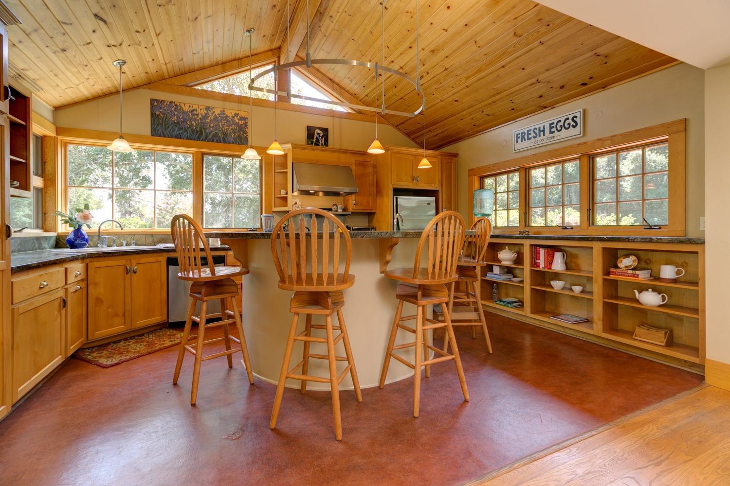 407 Del Norte Road Ojai, CA 93023 - Photo 15 of 39 a view of a dining room with furniture and wooden floor