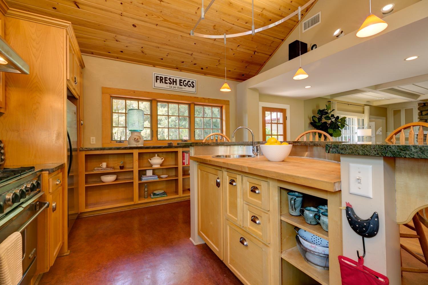 407 Del Norte Road Ojai, CA 93023 - Photo 17 of 39 a large kitchen with stainless steel appliances wooden floor and a large window