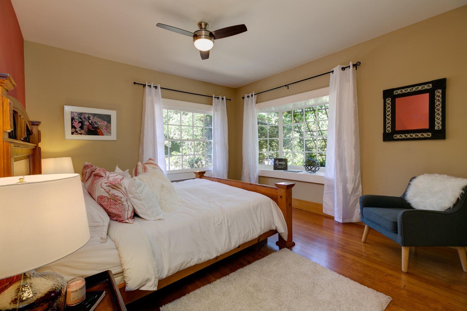 407 Del Norte Road Ojai, CA 93023 - Photo 24 of 39 a bedroom with a bed wooden floor and window
