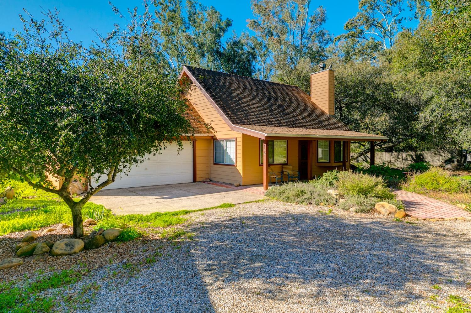 407 Del Norte Road Ojai, CA 93023 - Photo 3 of 39 a front view of a house with a yard and garage