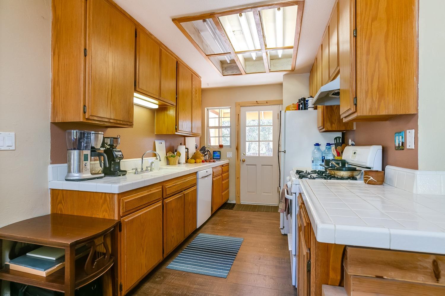 407 Del Norte Road Ojai, CA 93023 - Photo 32 of 39 a kitchen with stainless steel appliances granite countertop a sink a stove and refrigerator