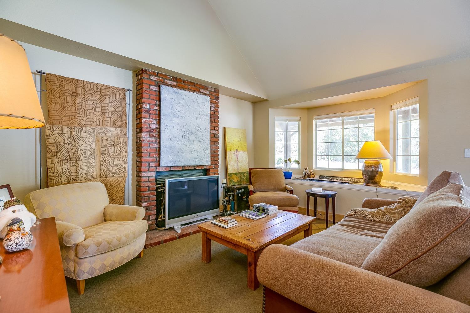 407 Del Norte Road Ojai, CA 93023 - Photo 33 of 39 a living room with furniture and a large window