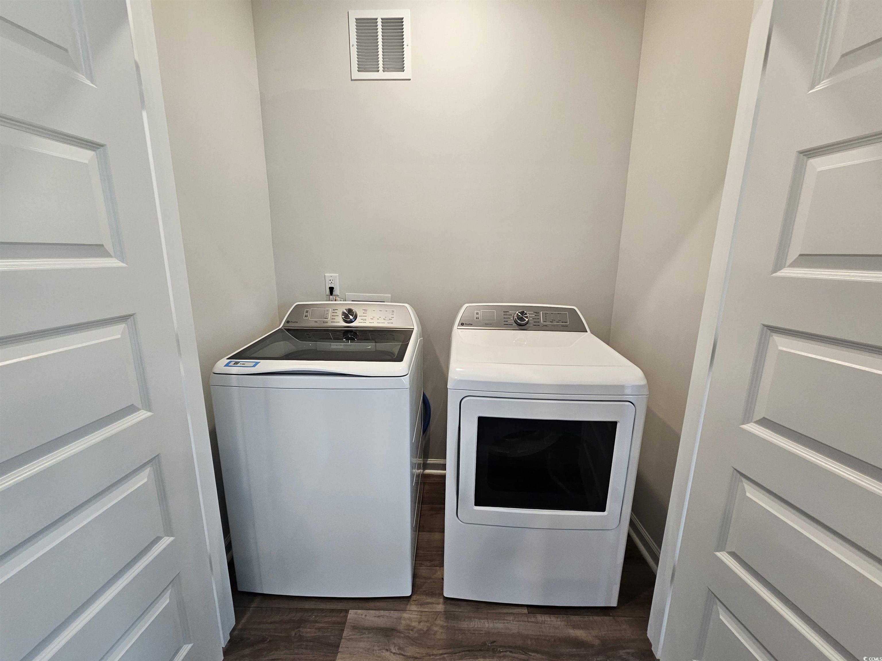 2100 Wild Indigo Circle Calabash, NC 28467 - Photo 21 of 31 Washroom featuring dark wood finished floors and independent washer and dryer