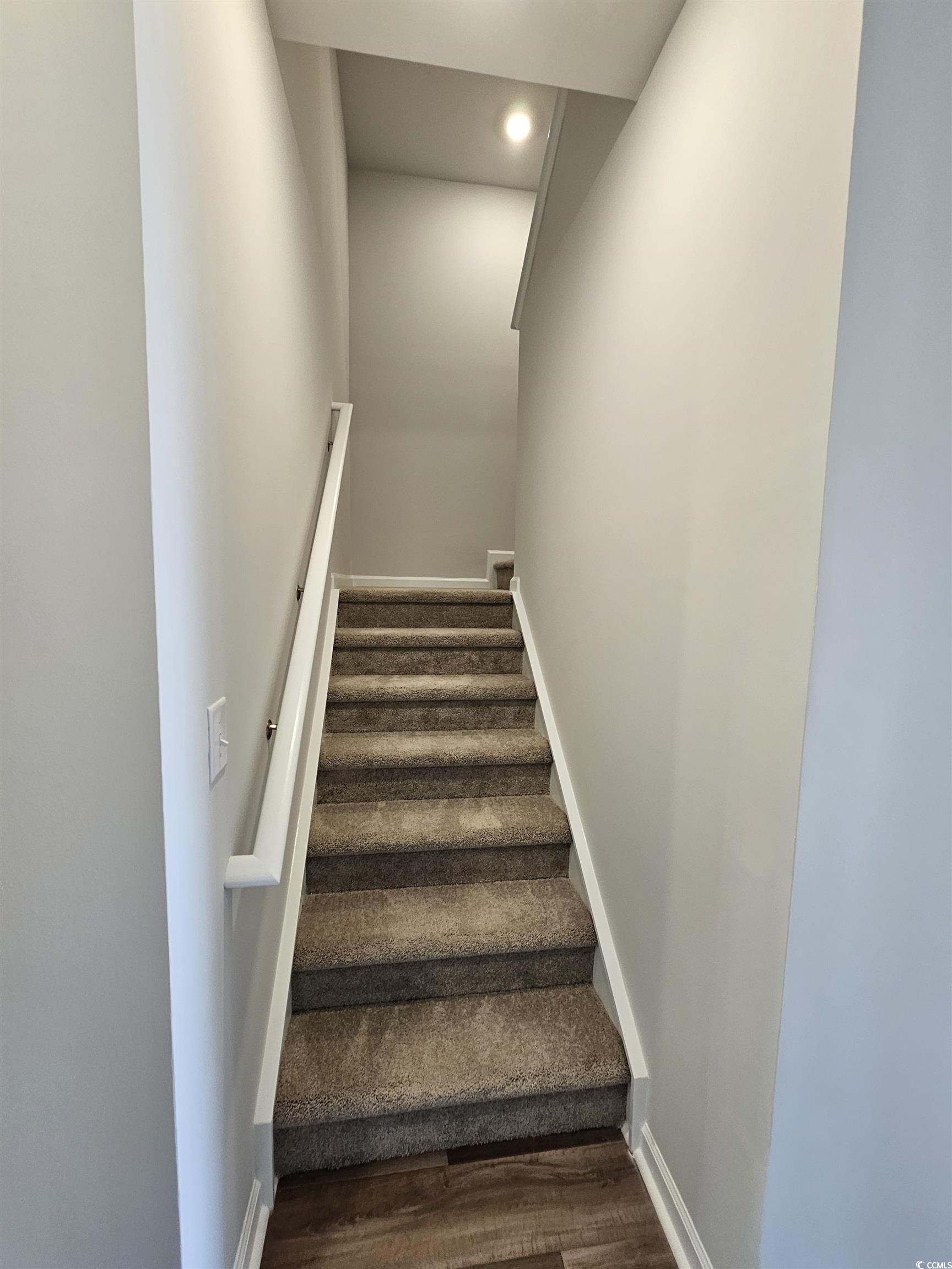 2100 Wild Indigo Circle Calabash, NC 28467 - Photo 22 of 31 Stairway with recessed lighting and wood finished floors