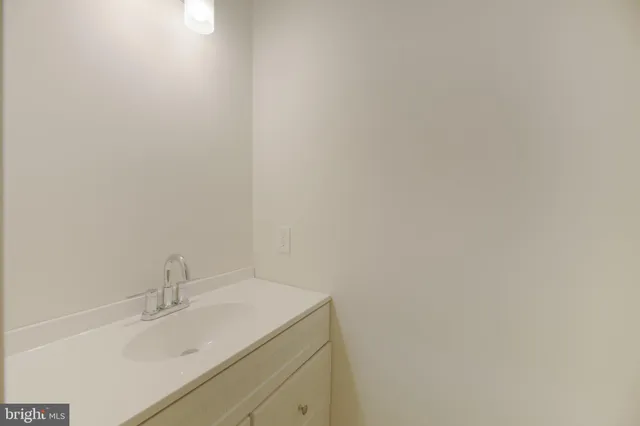 a bathroom with a sink and vanity