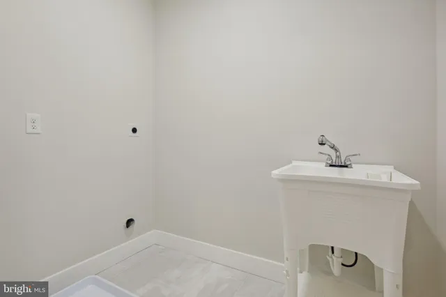 a bathroom with a sink and vanity