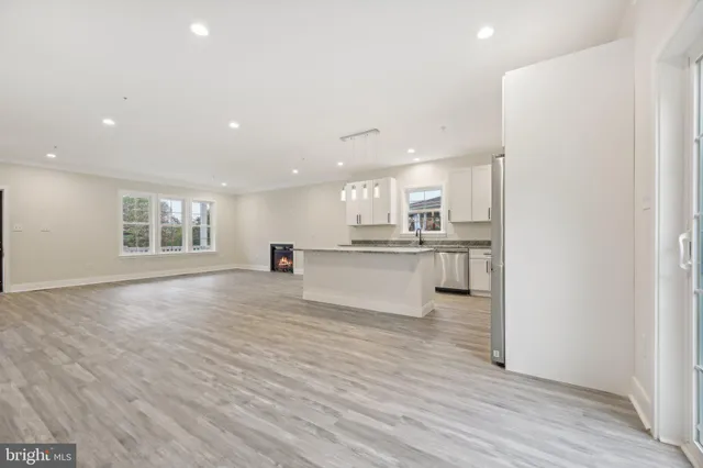 a view of kitchen with wooden floor and window