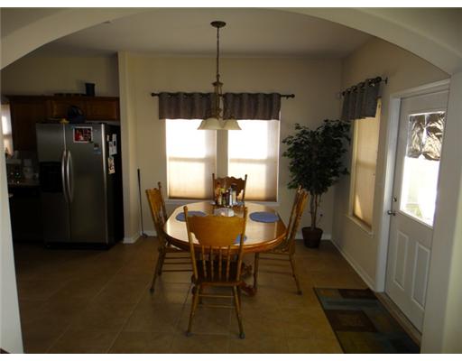 312 San Rafael Drive Portland, TX 78374 - Photo 3 of 10 a view of a dining room with furniture window and wooden floor