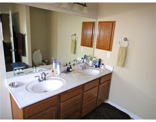 312 San Rafael Drive Portland, TX 78374 - Photo 9 of 10 a bathroom with a sink vanity and mirror