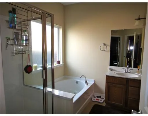 a bathroom with a sink and mirror