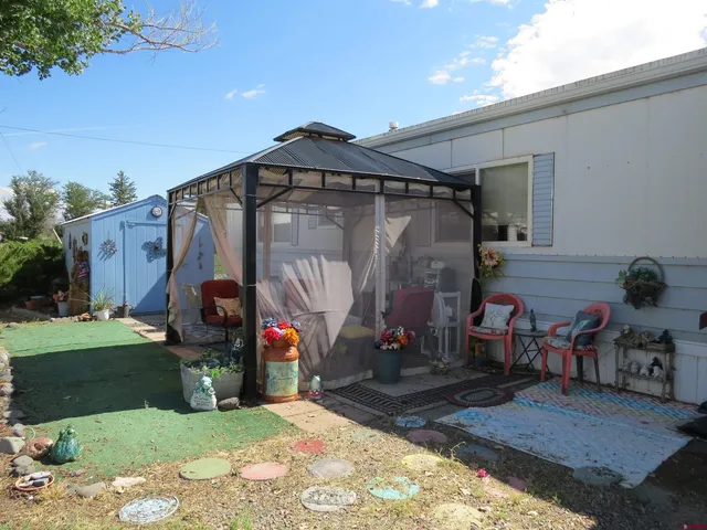 a view of a car park in front of house