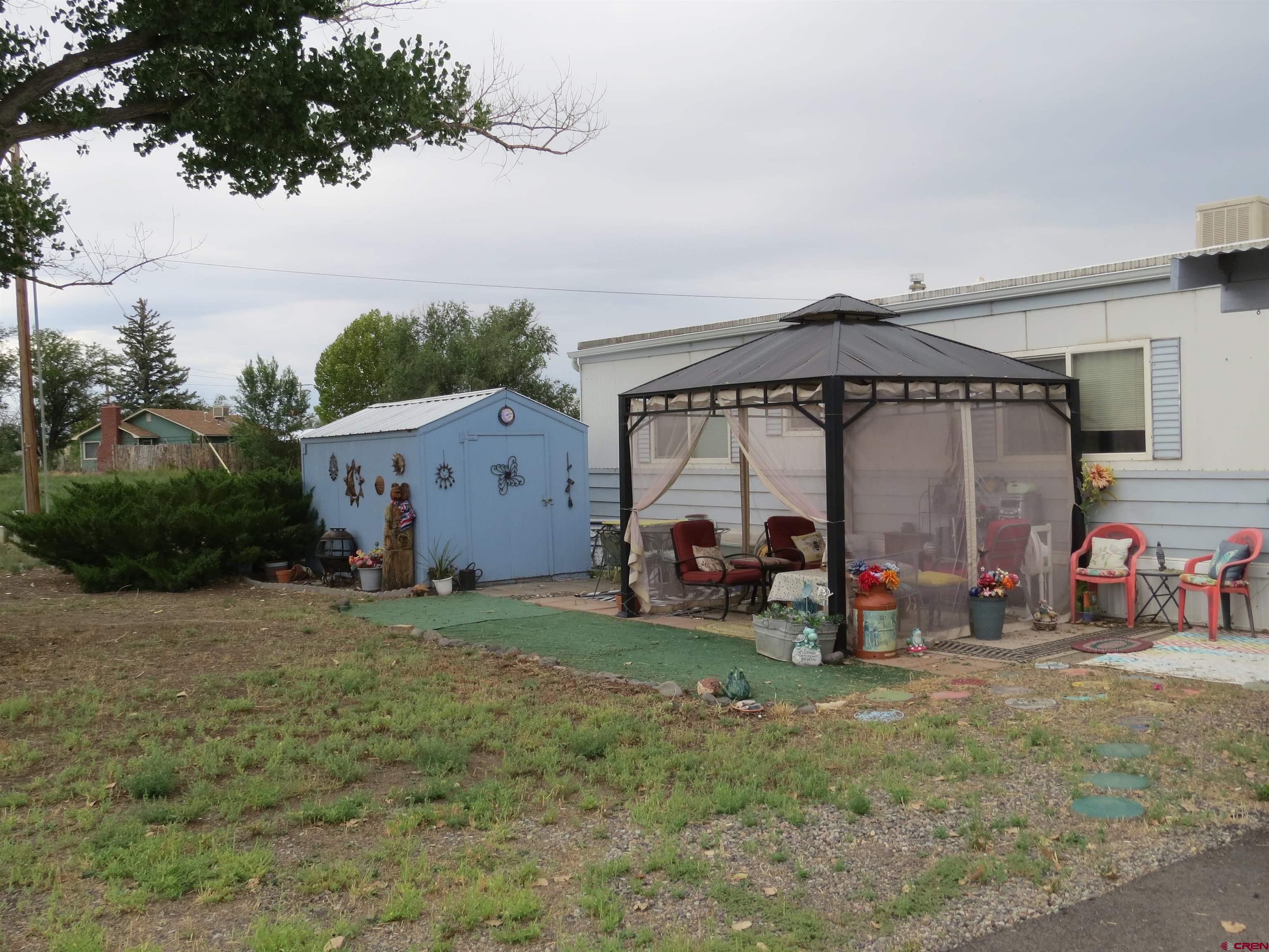 20028 Justice Road Austin, CO 81410 - Photo 19 of 22 a view of a car is parked in front of house