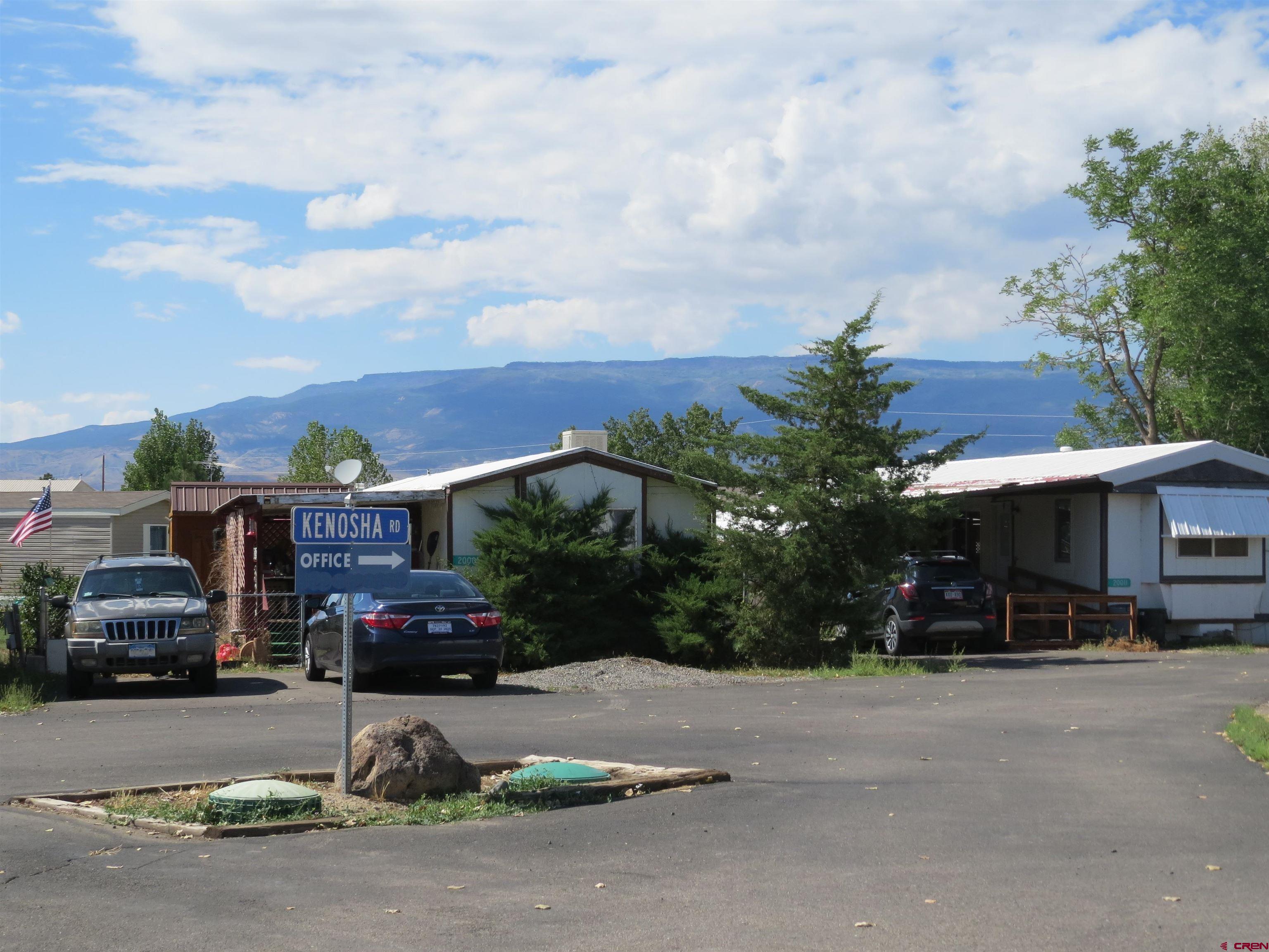 20028 Justice Road Austin, CO 81410 - Photo 22 of 22 a car parked in front of a building