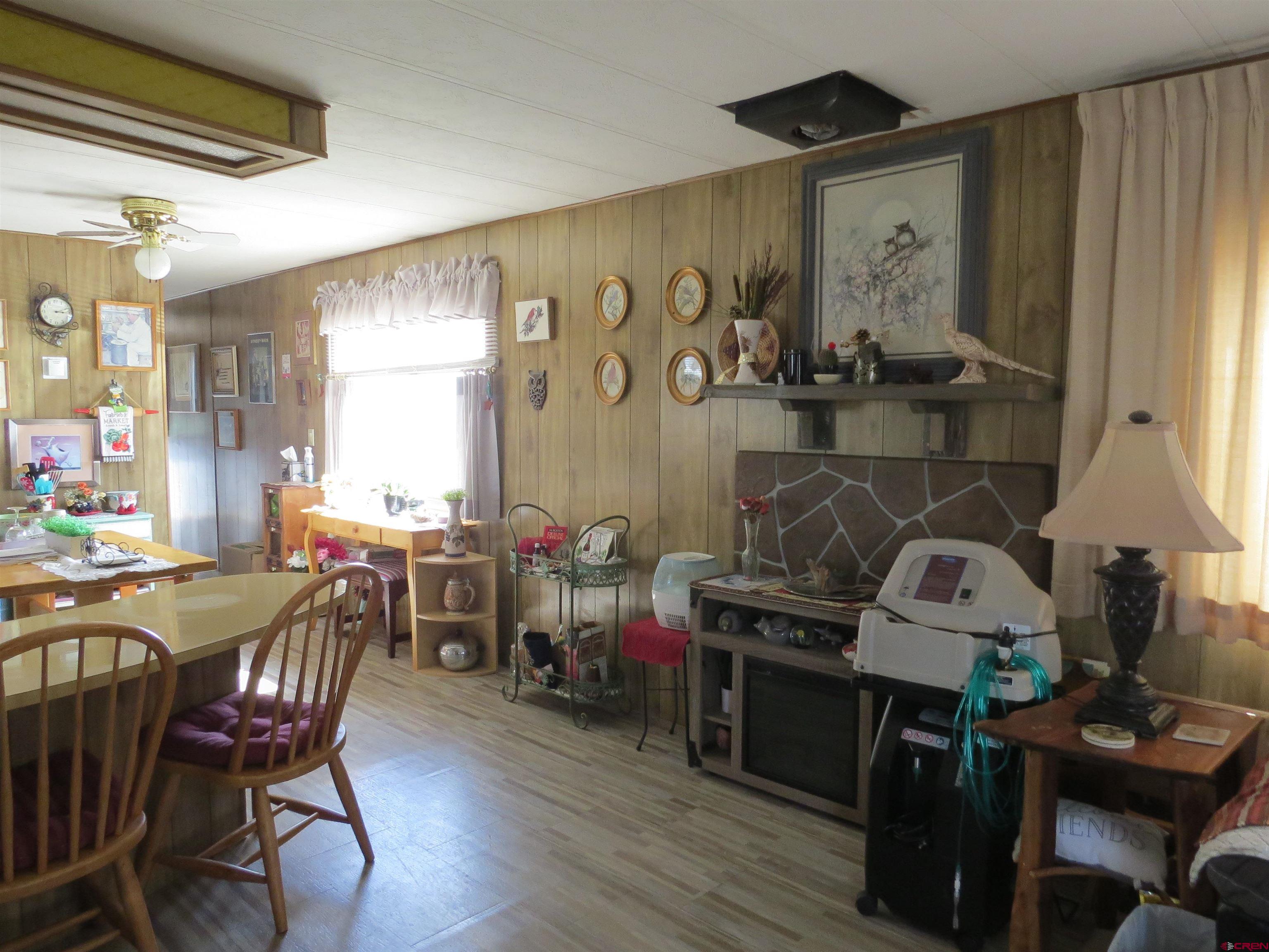 20028 Justice Road Austin, CO 81410 - Photo 5 of 22 a view of a dining room with furniture and window