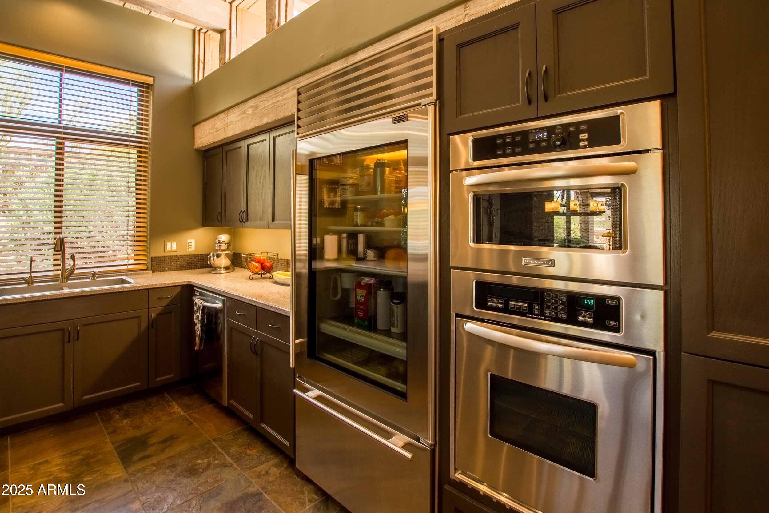 8502 East Cave Creek Road, Unit 61 Carefree, AZ 85377 - Photo 22 of 52 a kitchen with granite countertop a stove and a microwave