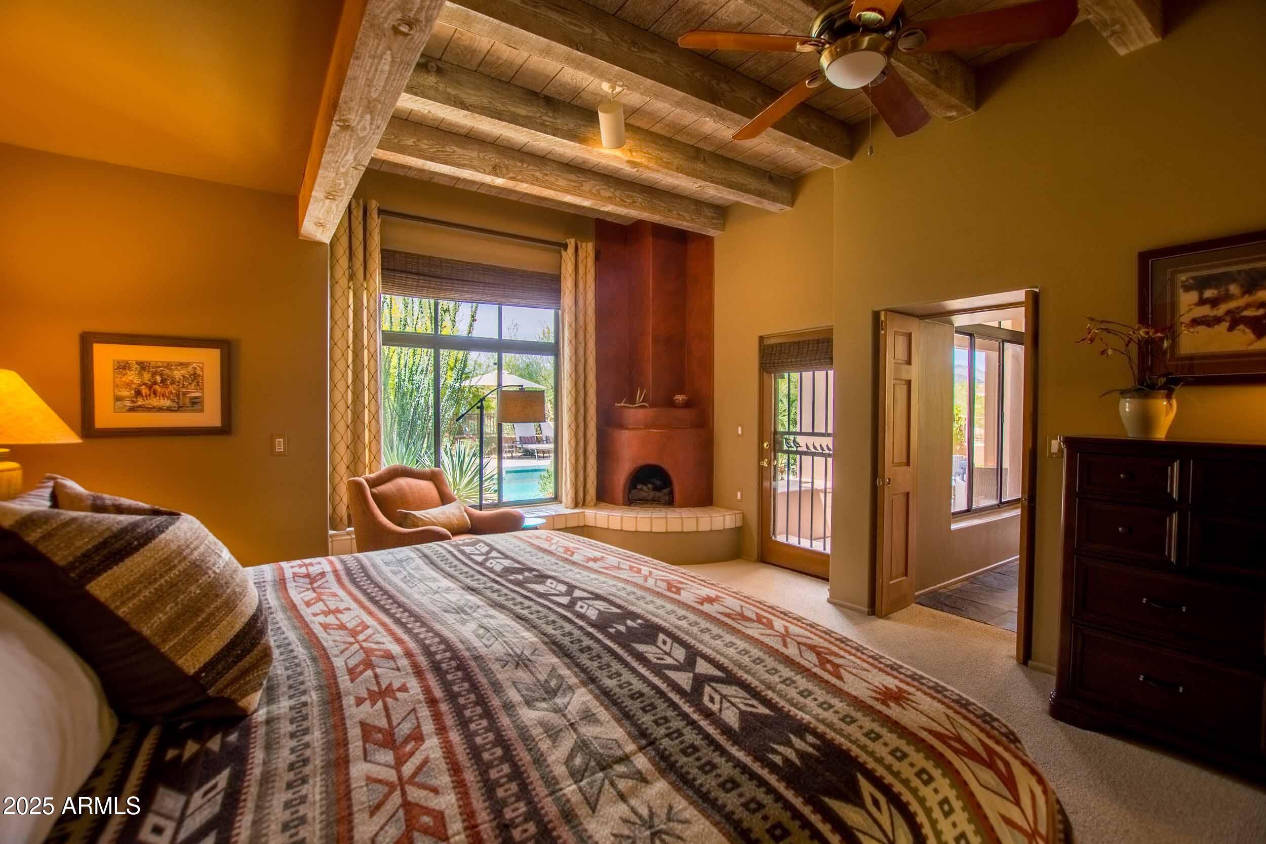 8502 East Cave Creek Road, Unit 61 Carefree, AZ 85377 - Photo 30 of 52 a bedroom with a bed and a dresser