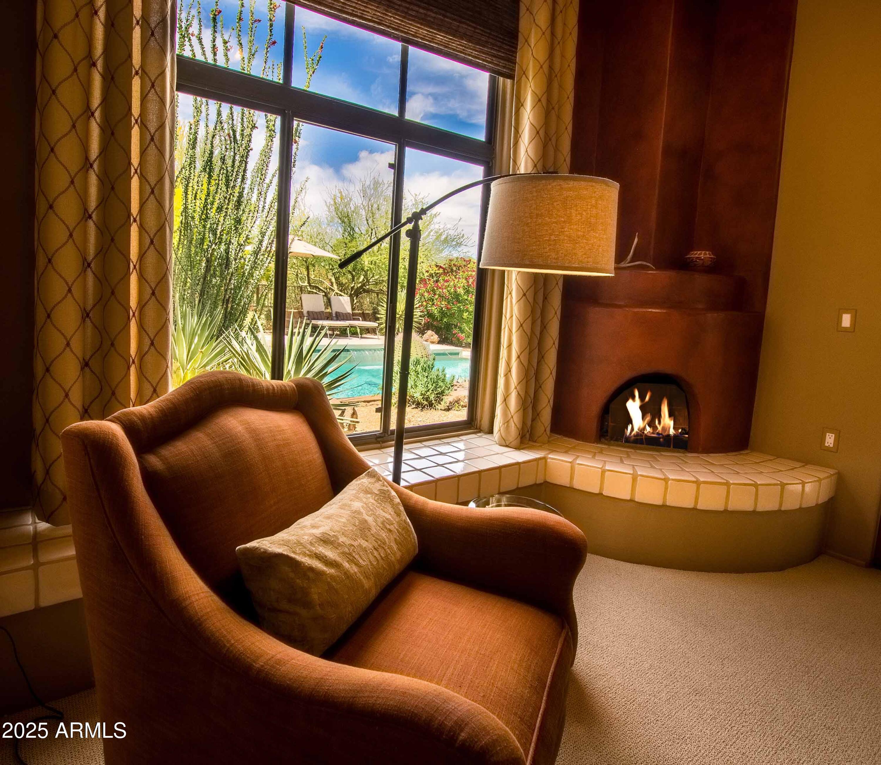 8502 East Cave Creek Road, Unit 61 Carefree, AZ 85377 - Photo 31 of 52 a living room with furniture and a lamp