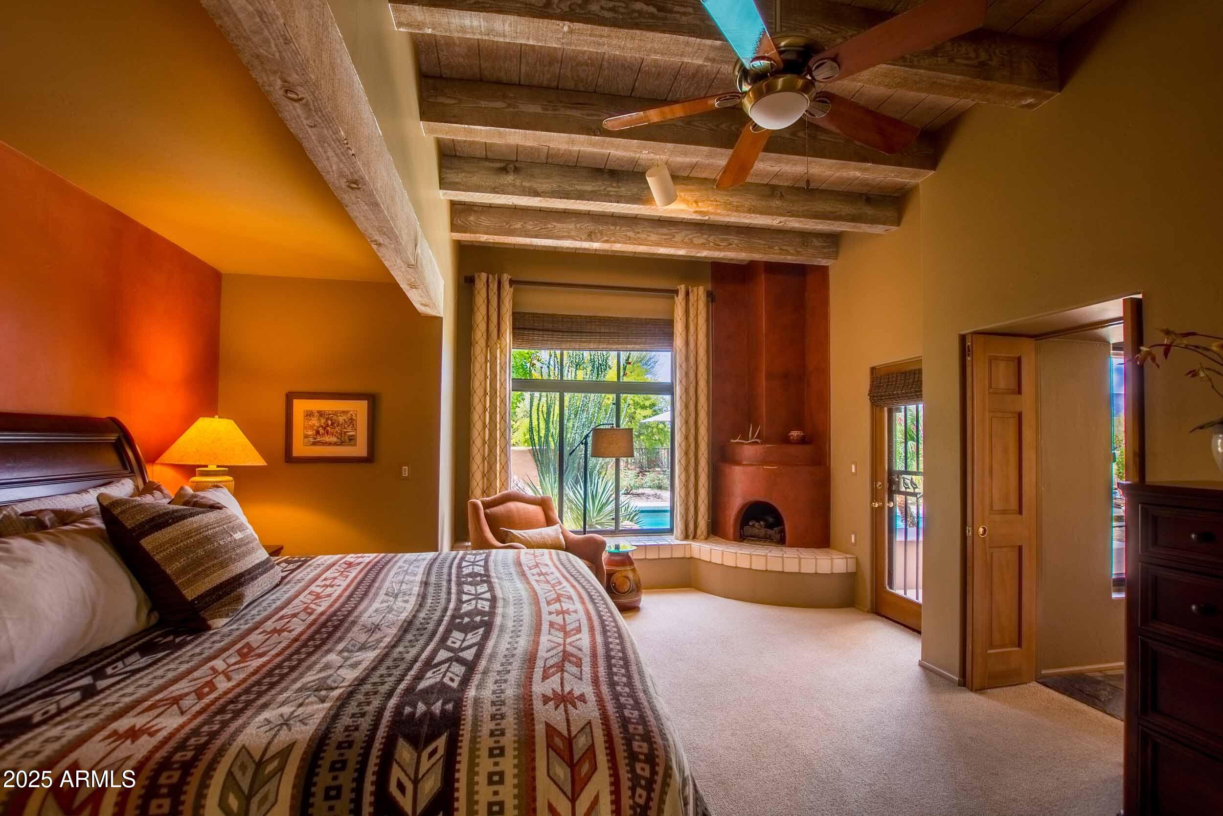 8502 East Cave Creek Road, Unit 61 Carefree, AZ 85377 - Photo 32 of 52 a bedroom with a bed and a large mirror