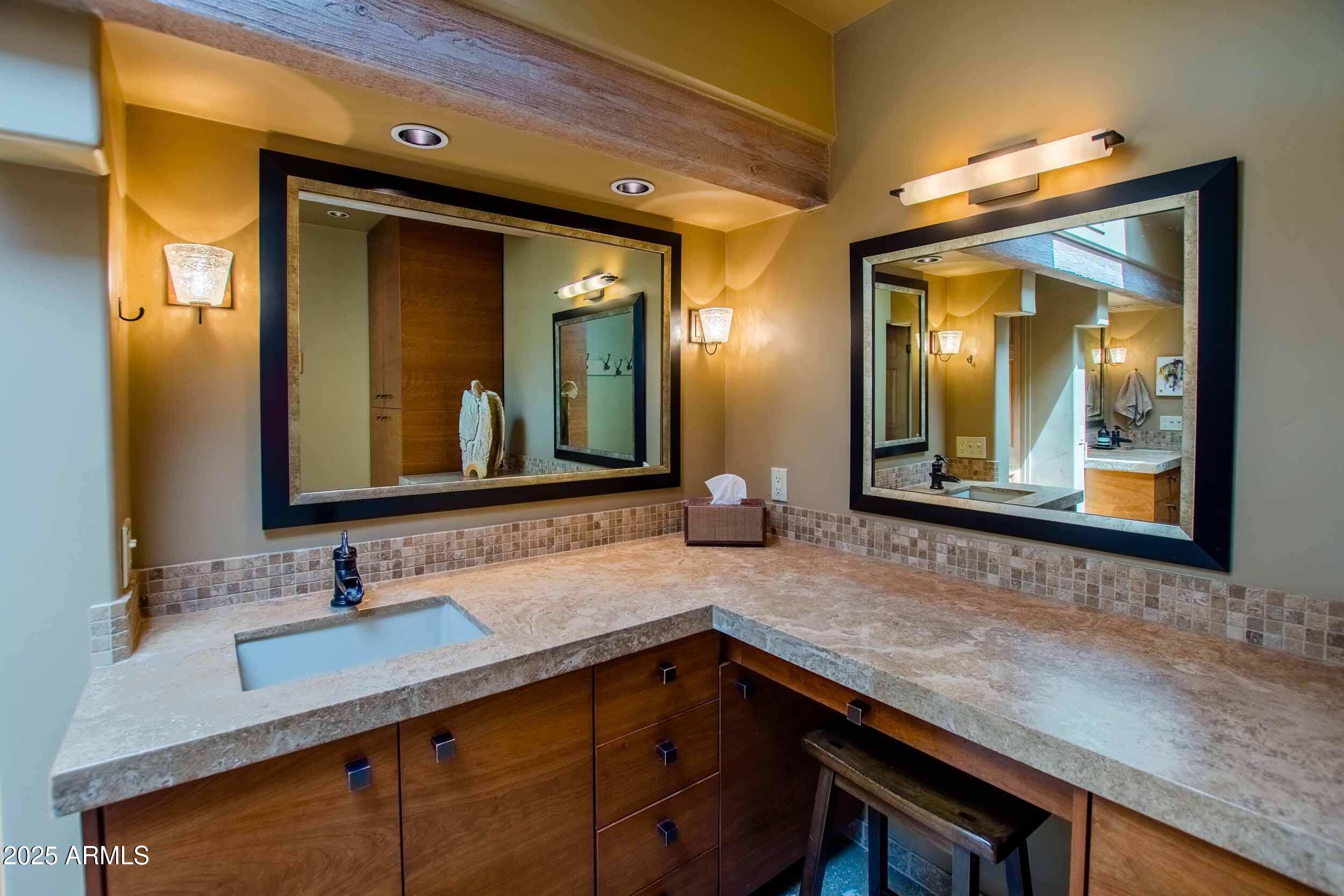 8502 East Cave Creek Road, Unit 61 Carefree, AZ 85377 - Photo 35 of 52 a bathroom with a sink and a mirror