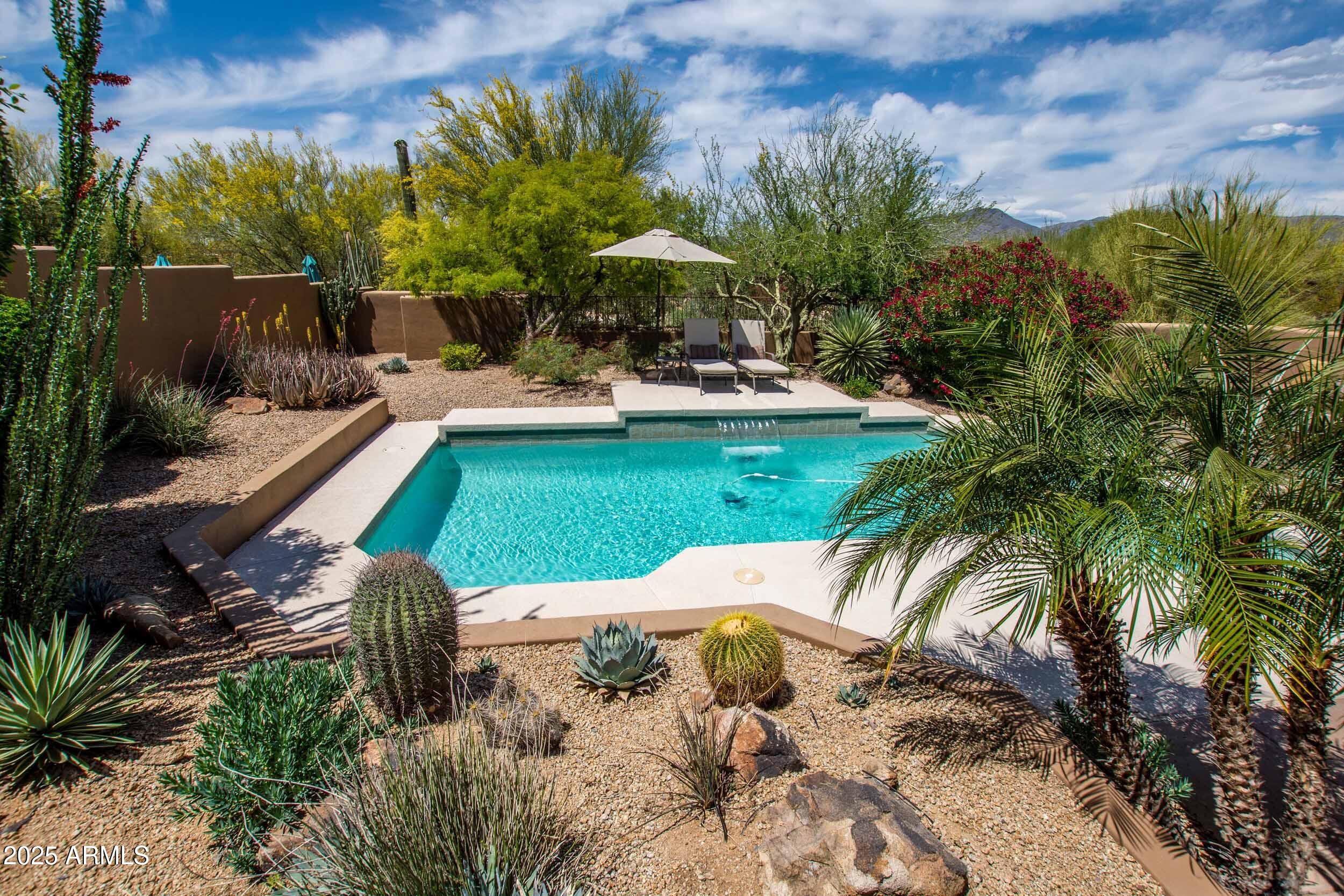 8502 East Cave Creek Road, Unit 61 Carefree, AZ 85377 - Photo 38 of 52 a view of a swimming pool with a patio