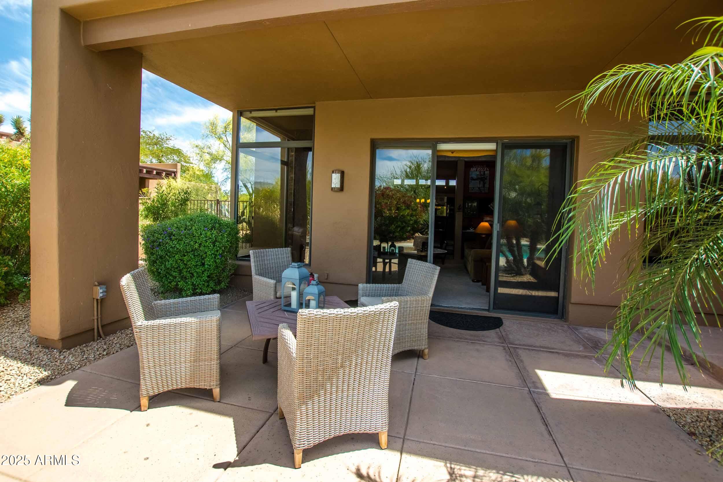 8502 East Cave Creek Road, Unit 61 Carefree, AZ 85377 - Photo 41 of 52 a building outdoor space with patio furniture and potted plants