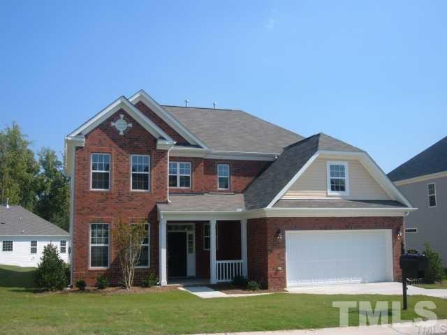 5220 Holly Ridge Farm Road Raleigh, NC 27616 - Photo 1 of 4 a front view of a house with a garden