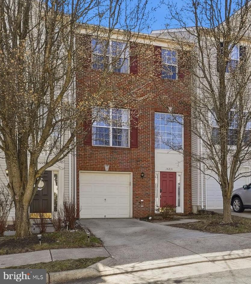 a front view of a building with trees