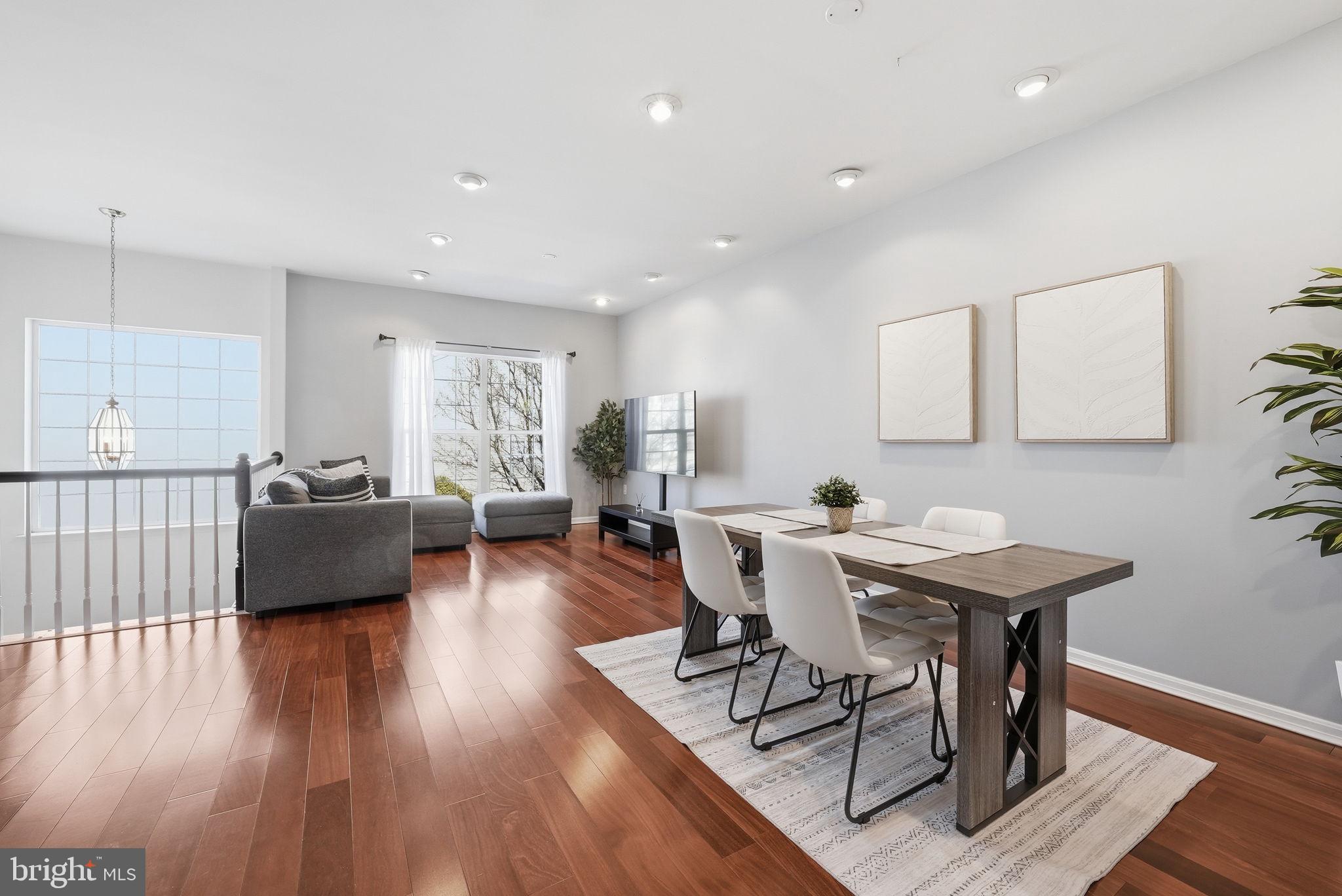 14231 Hunters Run Way Gainesville, VA 20155 - Photo 13 of 41 a view of a dining room with furniture and wooden floor