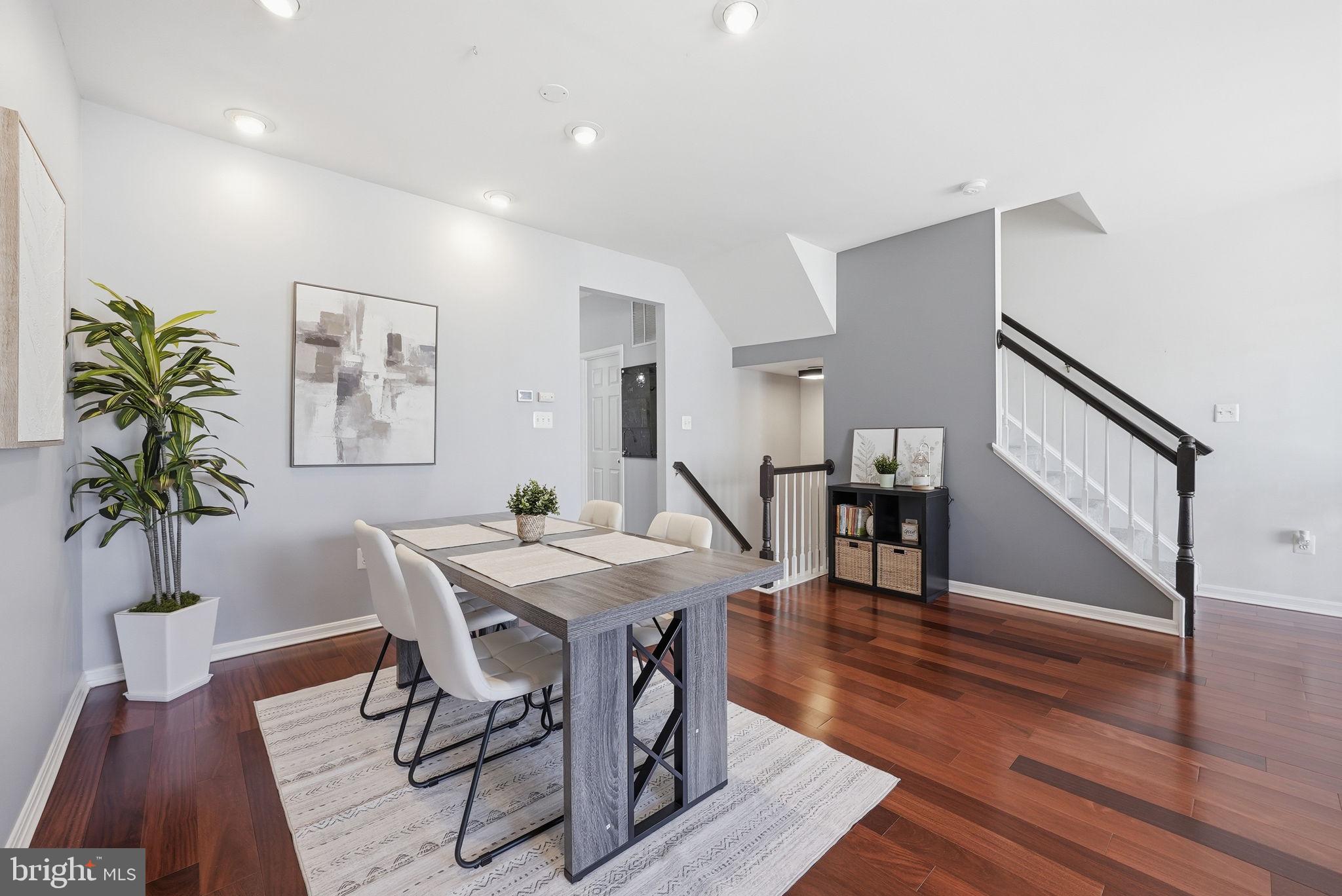 14231 Hunters Run Way Gainesville, VA 20155 - Photo 14 of 41 a view of a dining room with furniture and wooden floor