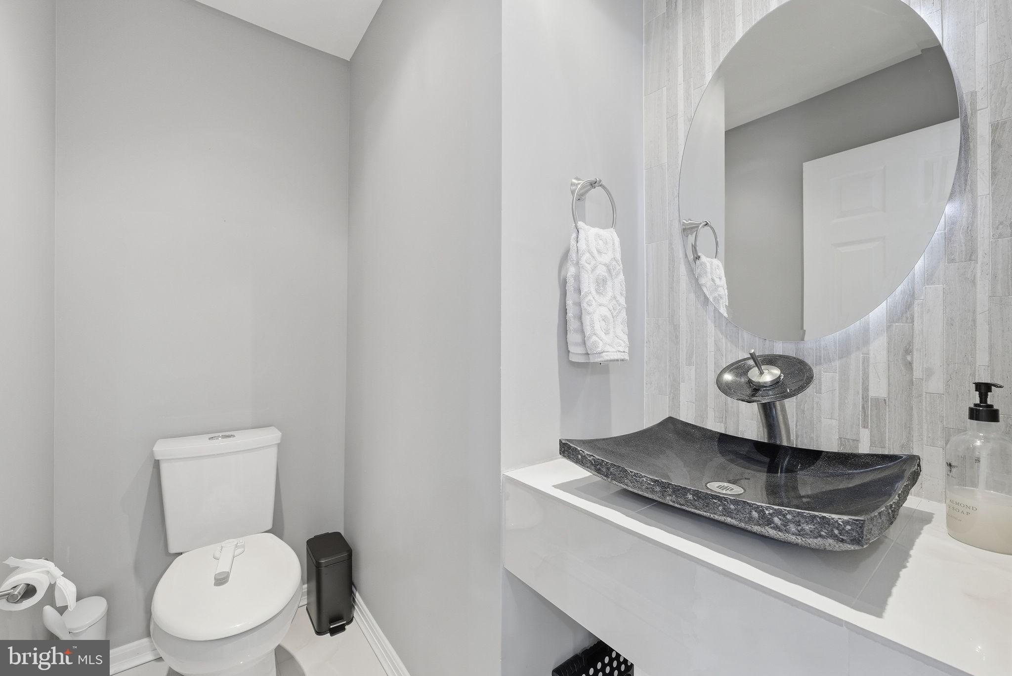 14231 Hunters Run Way Gainesville, VA 20155 - Photo 17 of 41 a close view of a toilet in the bathroom