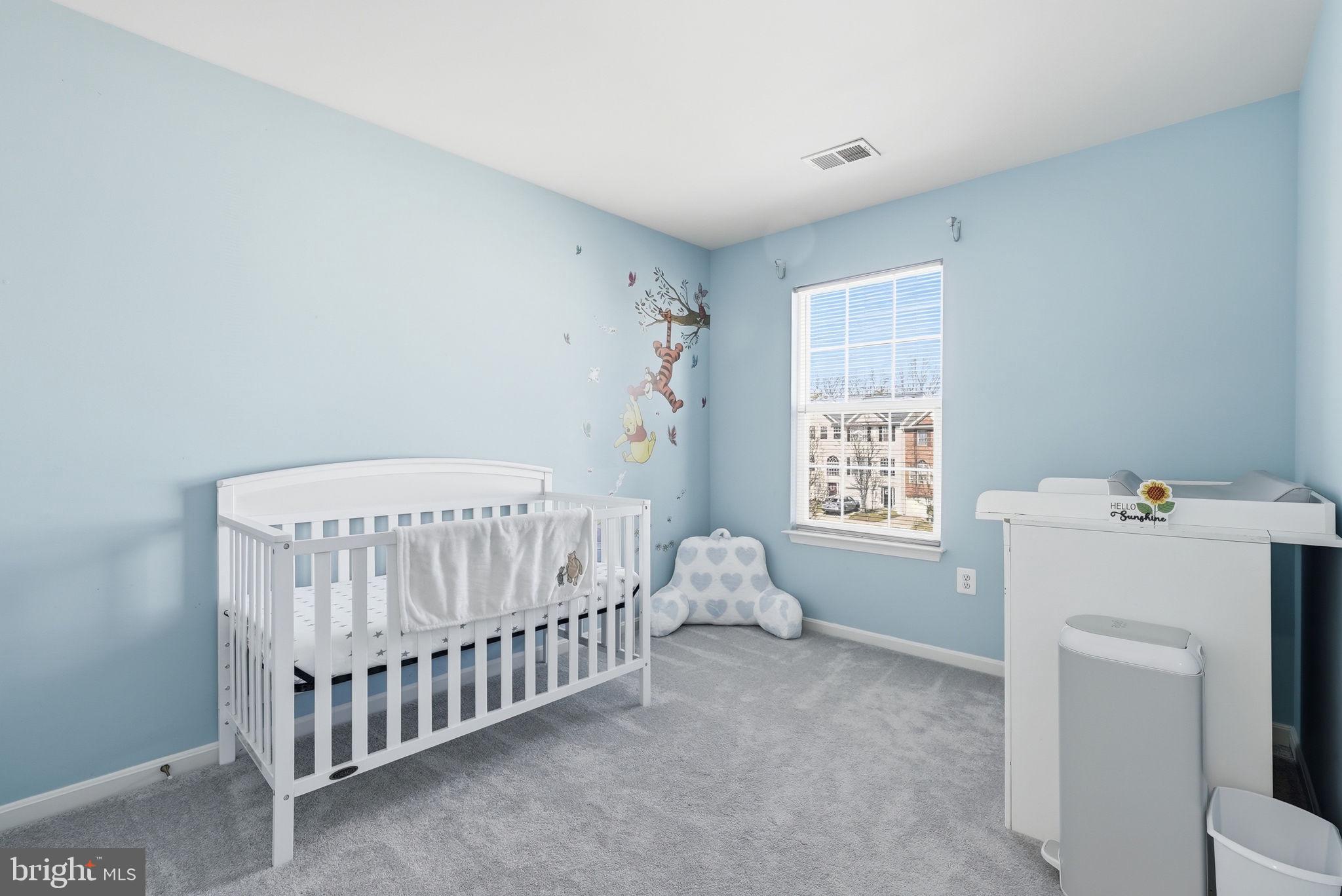 14231 Hunters Run Way Gainesville, VA 20155 - Photo 24 of 41 a bedroom with a bed and a window