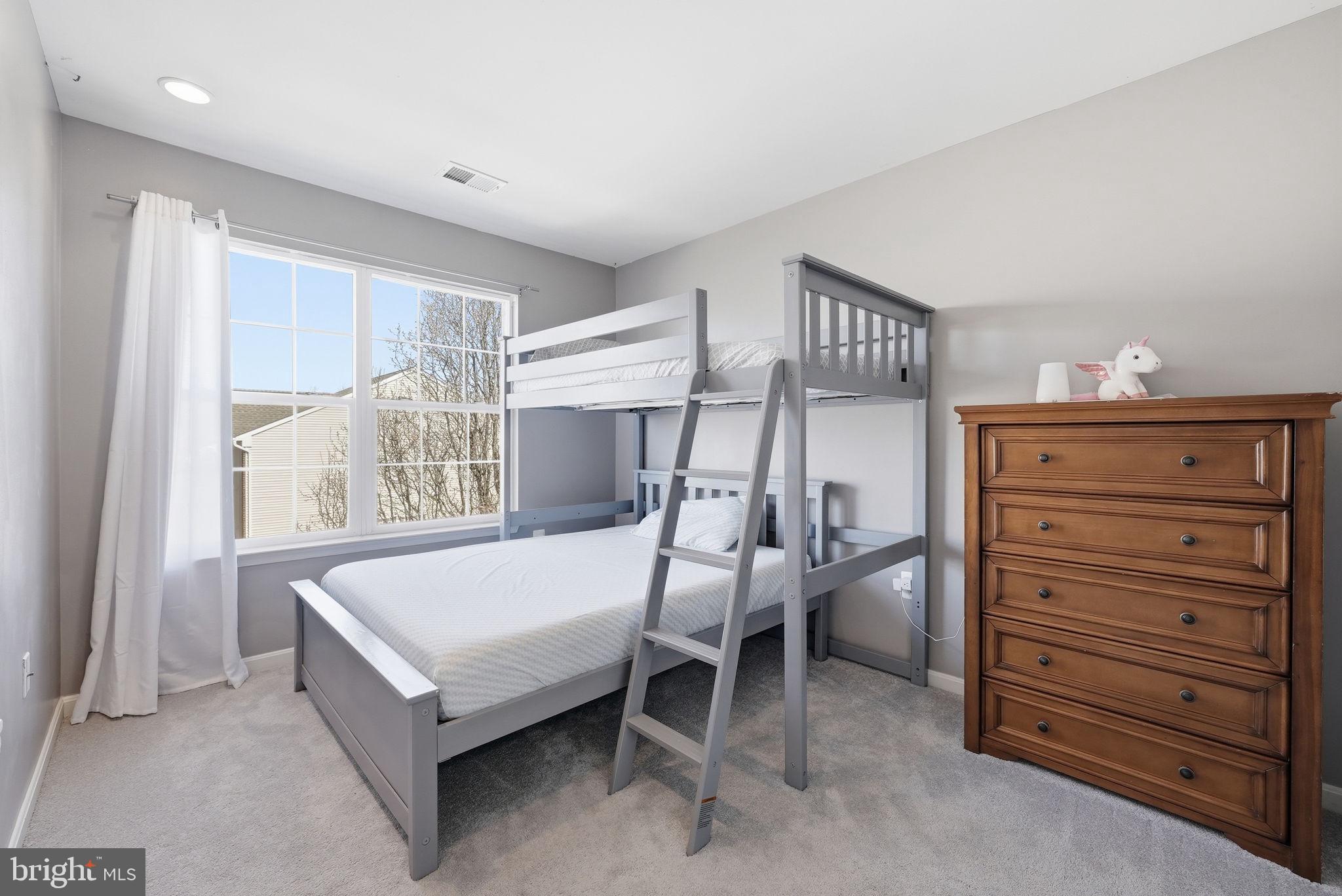 14231 Hunters Run Way Gainesville, VA 20155 - Photo 25 of 41 a bedroom with a bed and a window