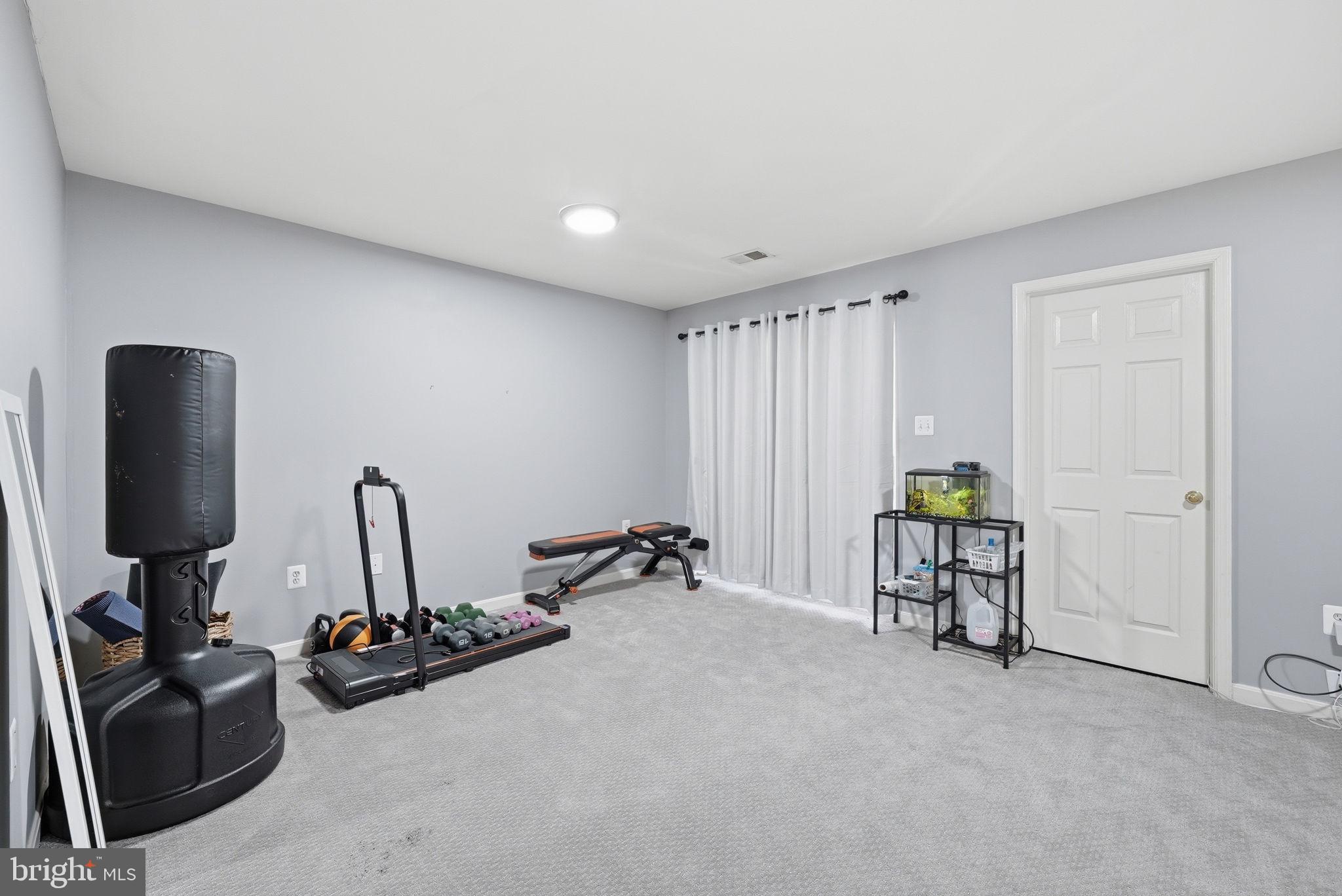 14231 Hunters Run Way Gainesville, VA 20155 - Photo 31 of 41 a view of a room with gym equipment