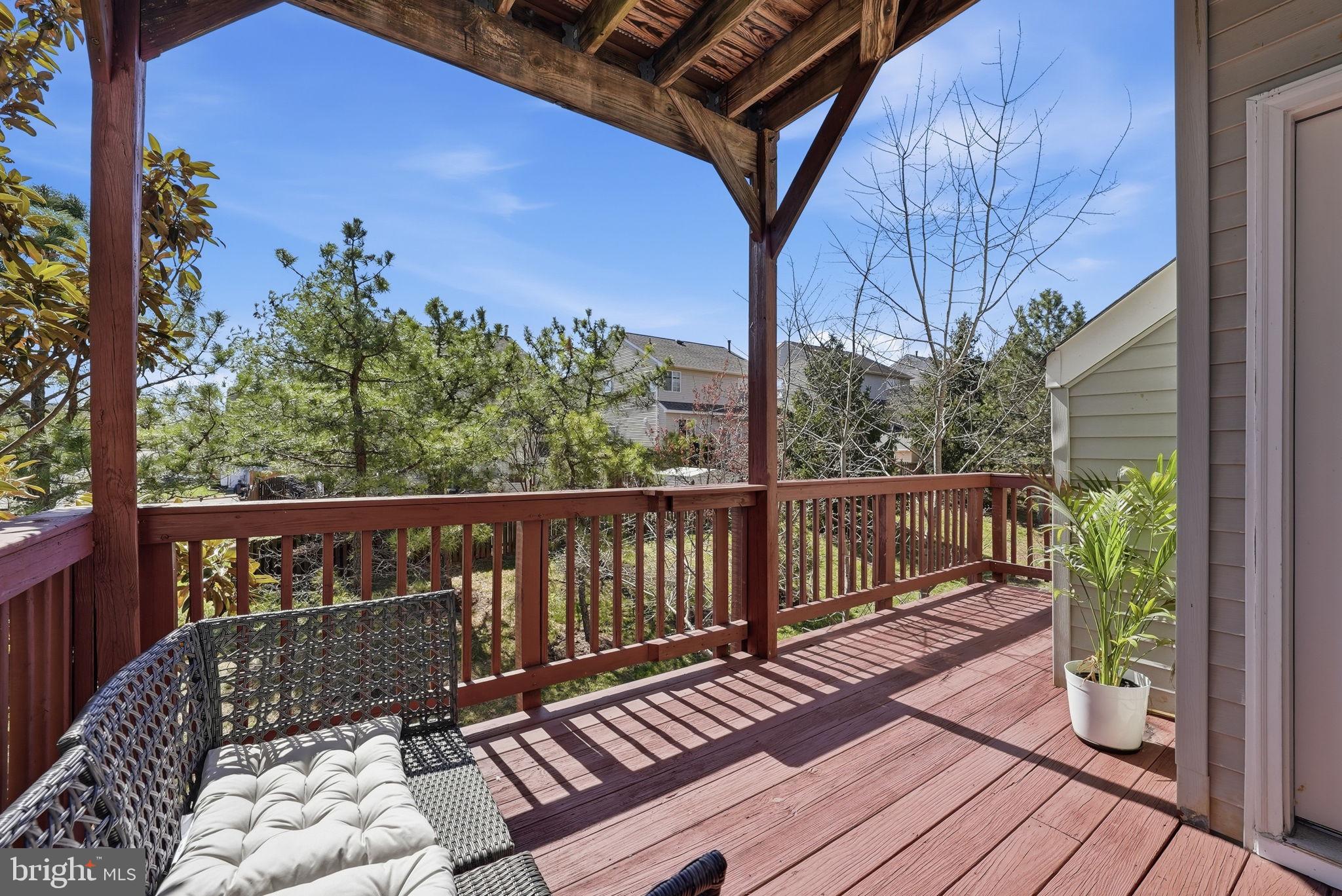 14231 Hunters Run Way Gainesville, VA 20155 - Photo 35 of 41 a view of balcony with wooden floor and outdoor seating