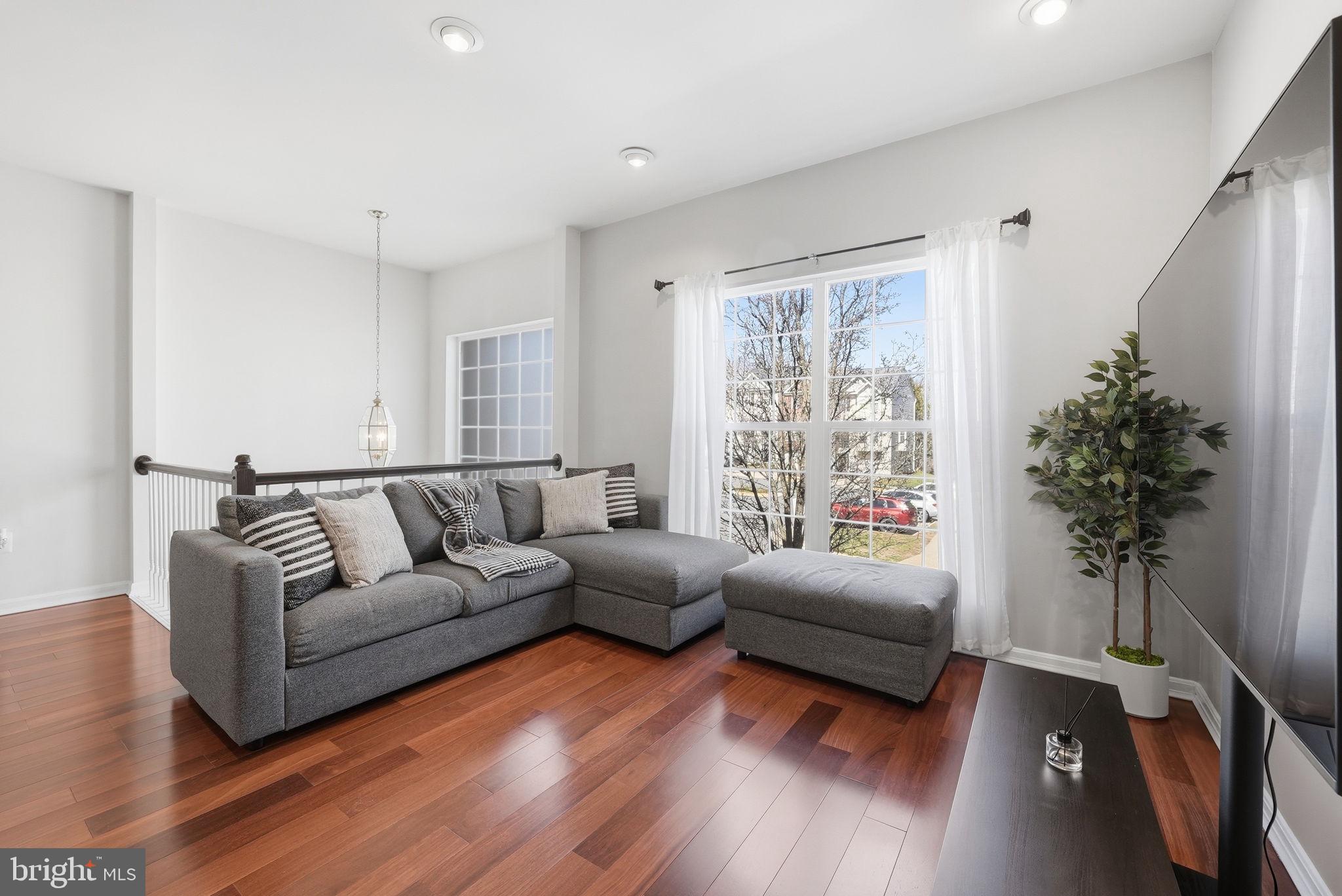 14231 Hunters Run Way Gainesville, VA 20155 - Photo 4 of 41 a living room with furniture and a large window