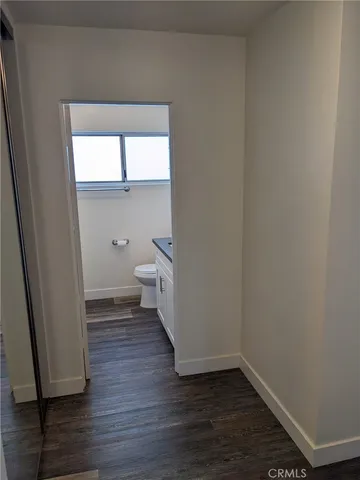 a view of a bathroom with wooden floor