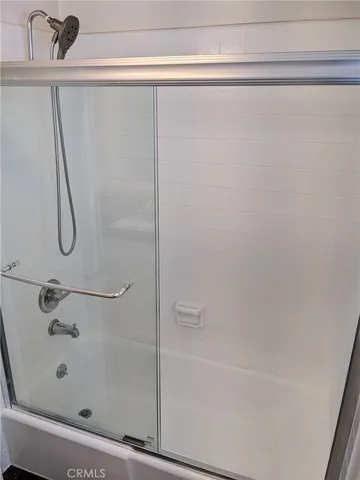 a bathroom with a shower and a bathtub