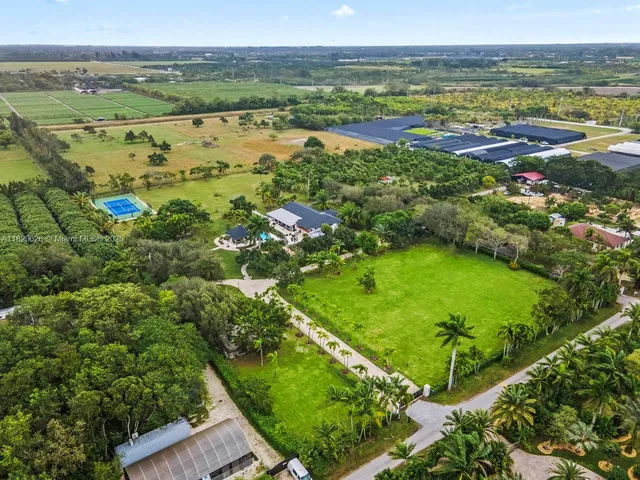 a view of tennis court with trees in the background