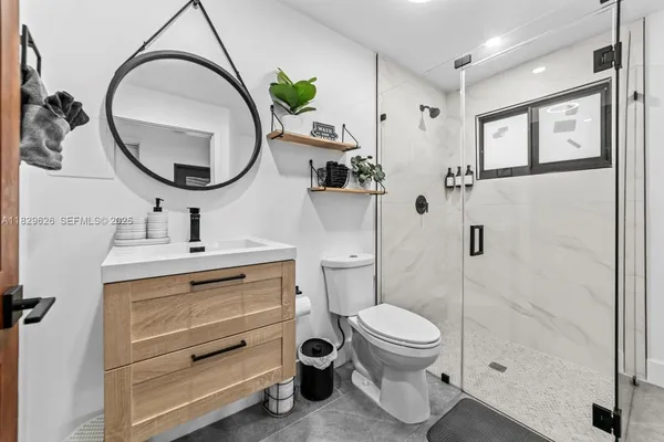 a bathroom with a sink double vanity and a mirror