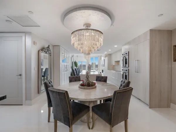 a living room with stainless steel appliances kitchen island granite countertop furniture and a kitchen view