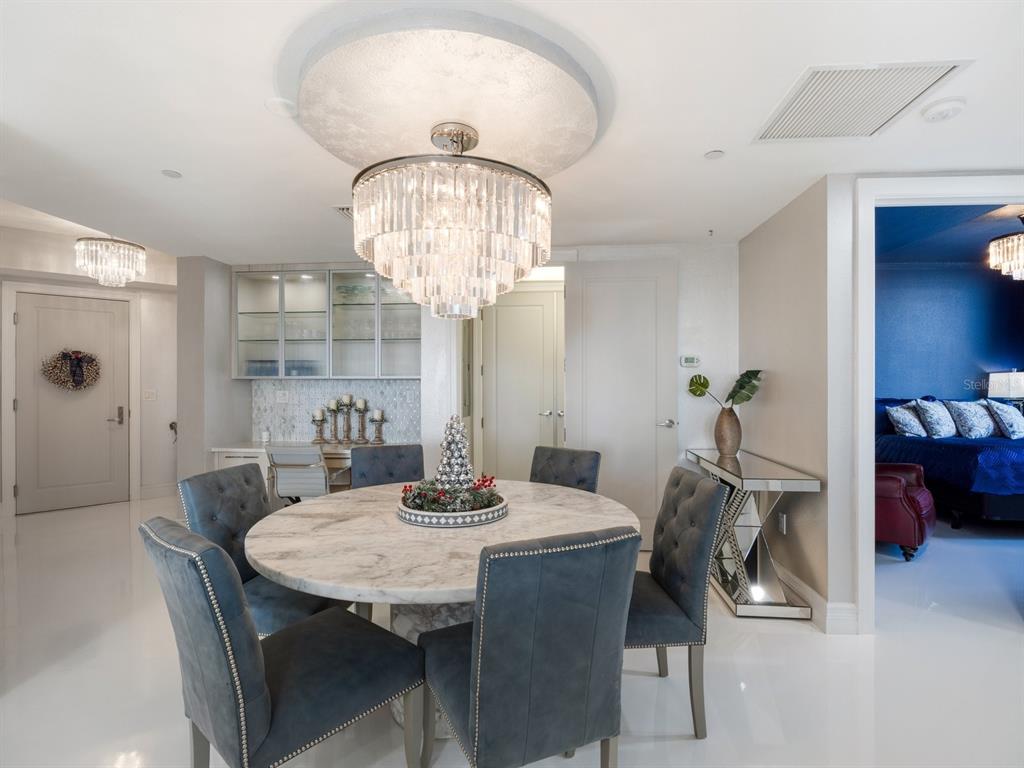 331 Cleveland Street, Unit 1101 Clearwater, FL 33755 - Photo 12 of 77 a view of a dining room with furniture and chandelier