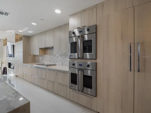 a bedroom with a bed and a television