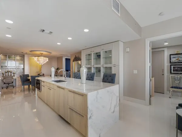 a bathroom with a sink a bathtub and a mirror