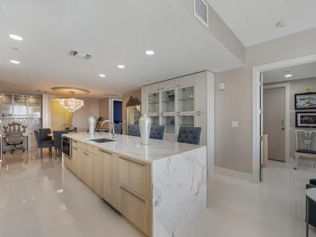 a bathroom with a sink a bathtub and a mirror