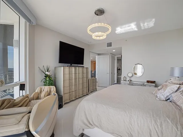 a spacious bathroom with a mirror and a shower