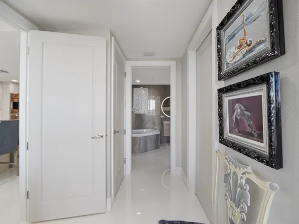 a bathroom with a glass shower door and a bathtub