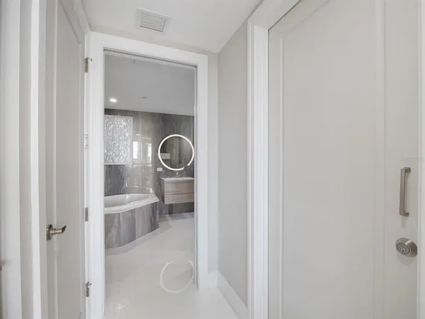 a view of a dining room with a table and chairs