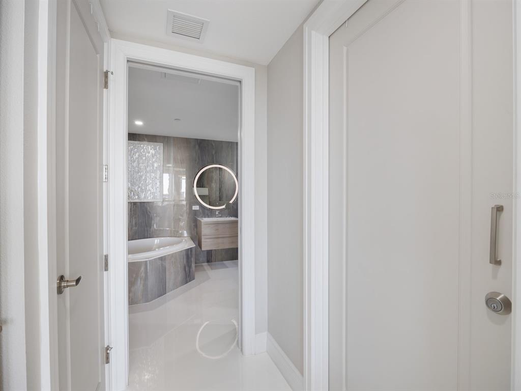 331 Cleveland Street, Unit 1101 Clearwater, FL 33755 - Photo 35 of 77 a bathroom with a sink and a mirror