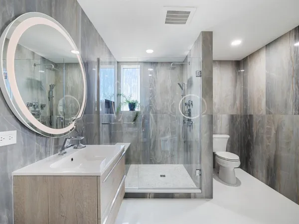 a living room with couches and a flat screen tv