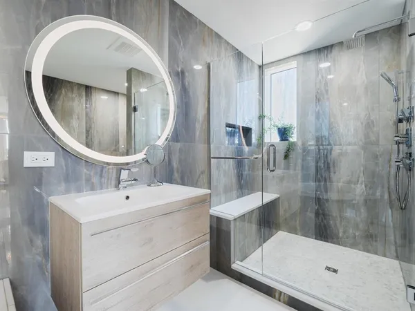 a large kitchen with granite countertop a stove top oven a sink dishwasher and a refrigerator